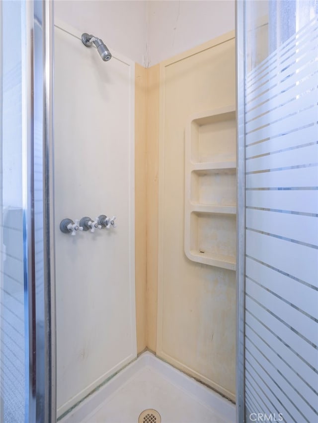 bathroom featuring walk in shower