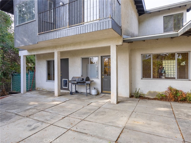 view of patio / terrace with a grill and a balcony