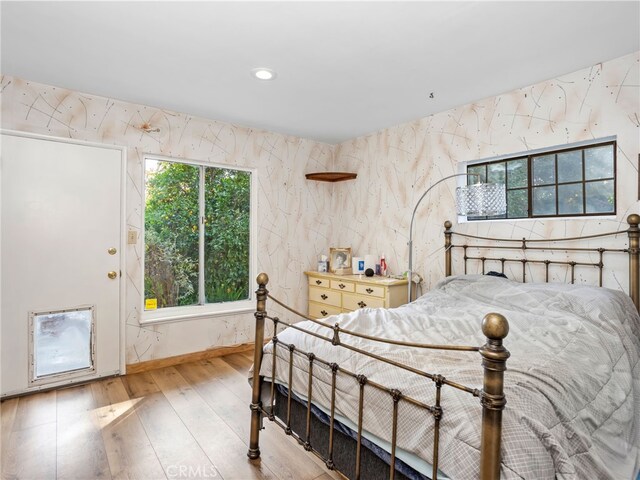 bedroom with light wood-type flooring