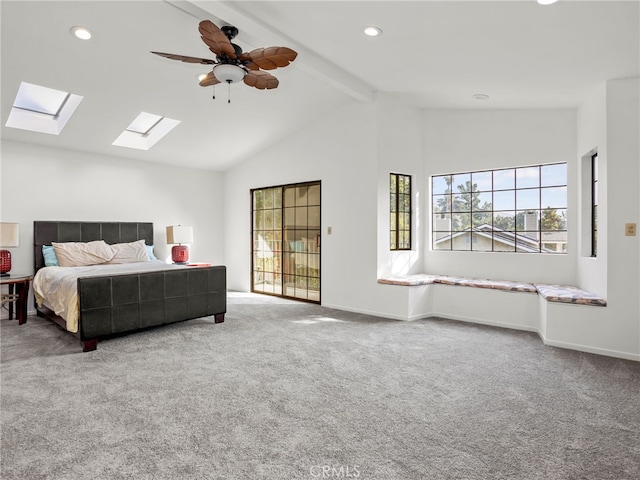 bedroom with ceiling fan, access to outside, lofted ceiling with skylight, and carpet floors