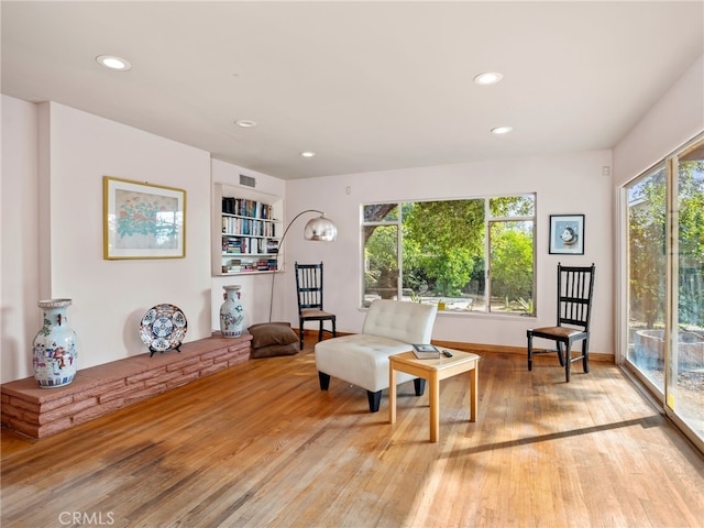 sitting room with light hardwood / wood-style floors