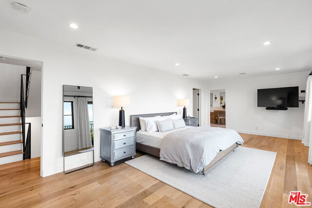 bedroom featuring light hardwood / wood-style floors