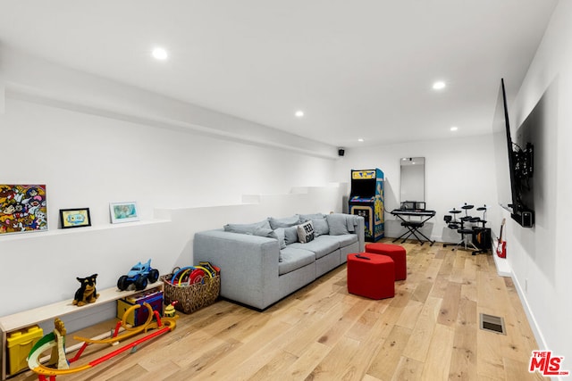 living room with light hardwood / wood-style floors