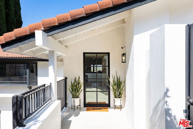 property entrance with a balcony