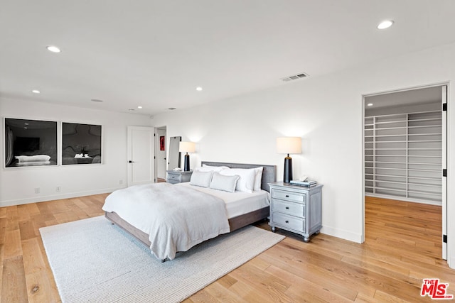 bedroom with light hardwood / wood-style flooring