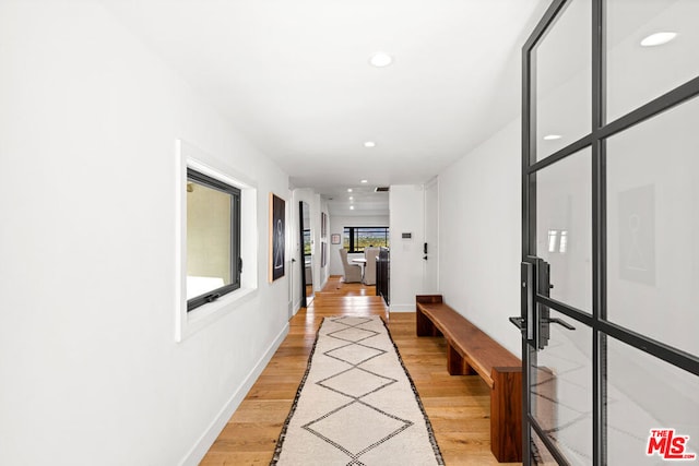 hallway with light wood-type flooring