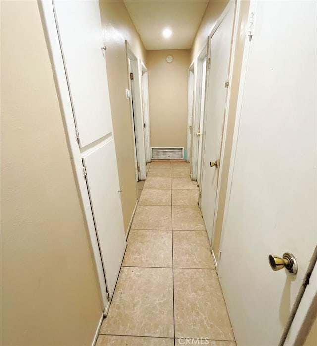 hallway with light tile patterned floors