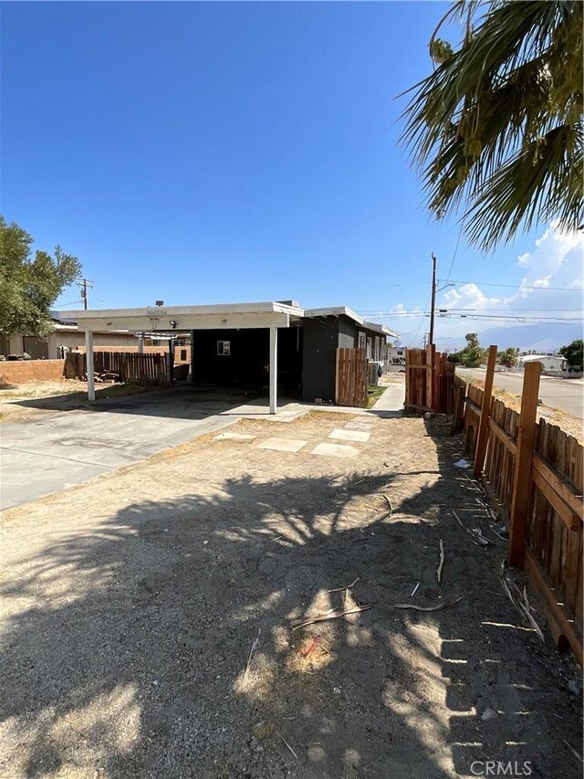 exterior space featuring a carport