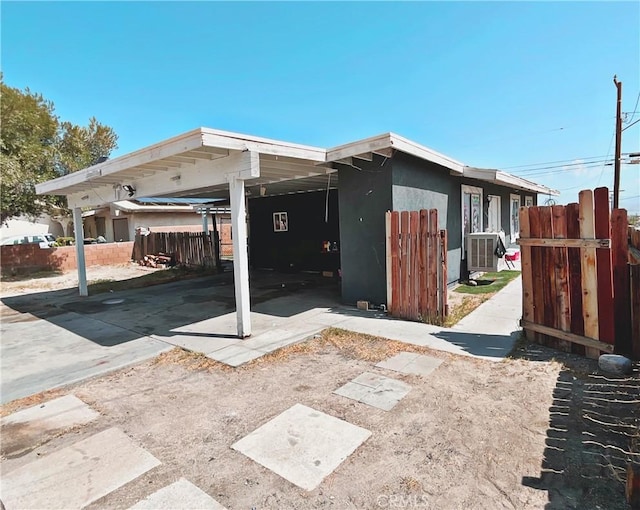 exterior space with a carport