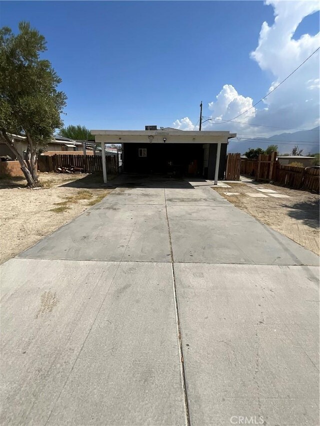 view of front of home featuring a carport