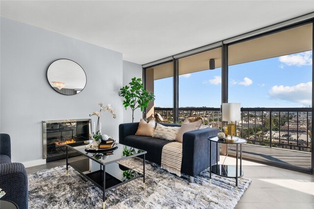 living room with a wall of windows and plenty of natural light