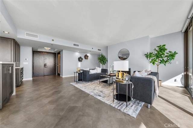 living room with concrete flooring