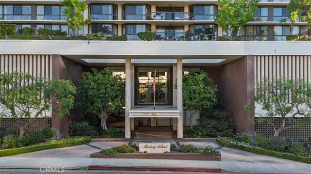 entrance to property with a balcony