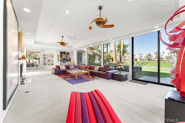 70854 Fairway Dr, Rancho Mirage, CA 92270 - carpeted living area with a wall of windows, a wealth of natural light, a ceiling fan, and recessed lighting