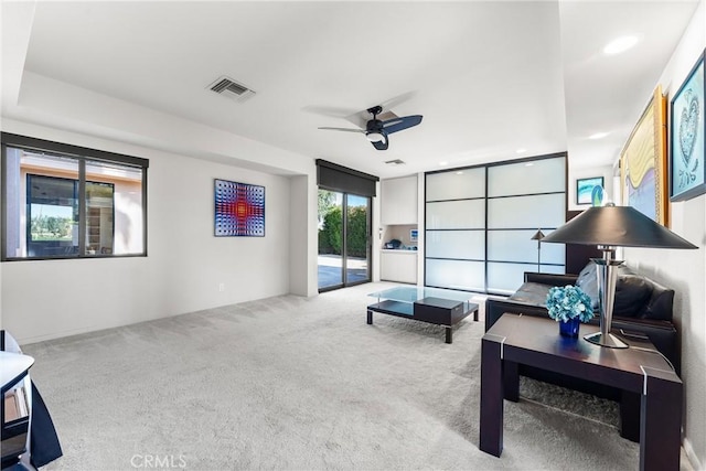 sitting room featuring visible vents, recessed lighting, a ceiling fan, and carpet floors