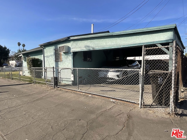 view of side of property featuring a carport