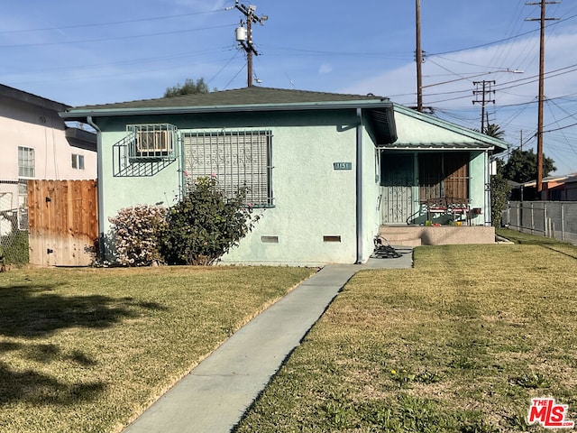 exterior space with a front lawn