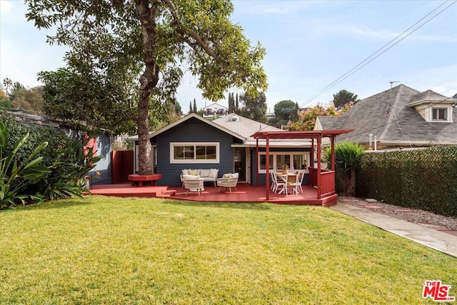 rear view of house with an outdoor living space, a wooden deck, a pergola, and a lawn