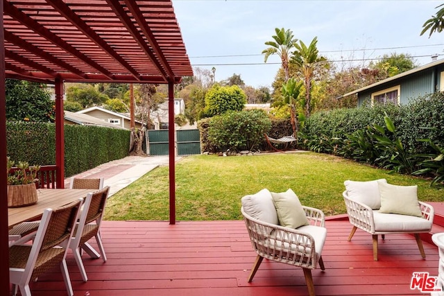 wooden deck with a pergola, an outdoor living space, and a lawn