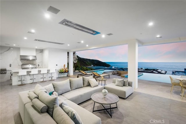 living area with visible vents and recessed lighting