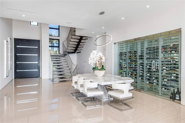 dining area featuring recessed lighting and stairway