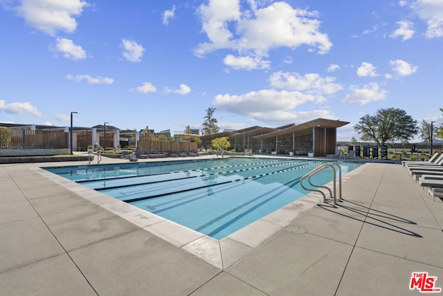 view of swimming pool featuring a patio