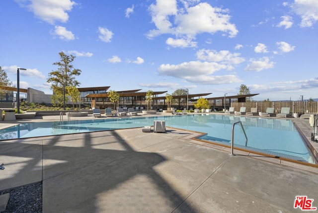 view of swimming pool with a patio area