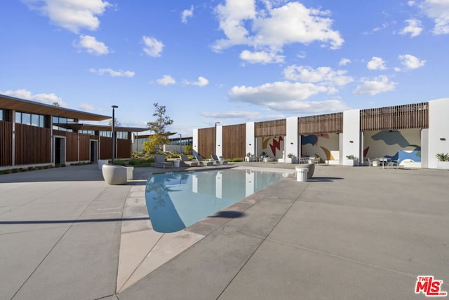 view of swimming pool featuring a patio