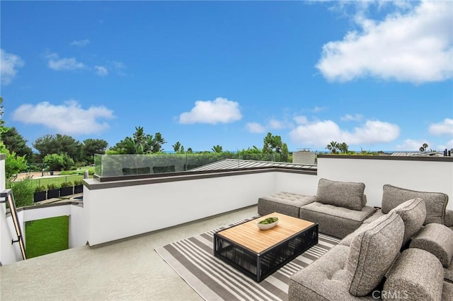 view of patio / terrace with a balcony and outdoor lounge area