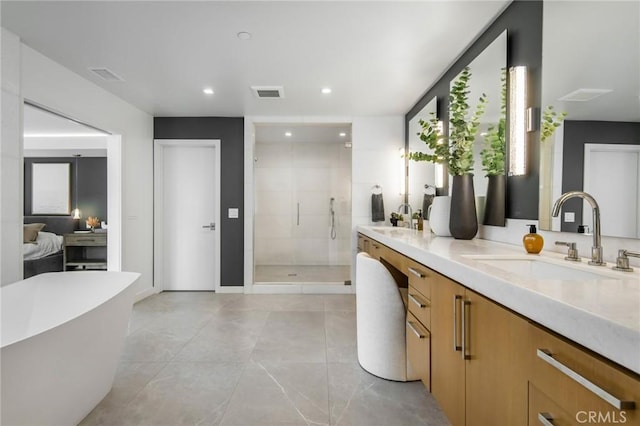 bathroom featuring independent shower and bath and vanity