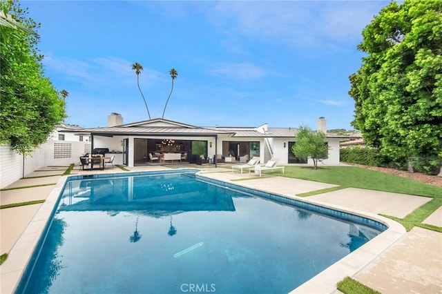 view of pool featuring a patio