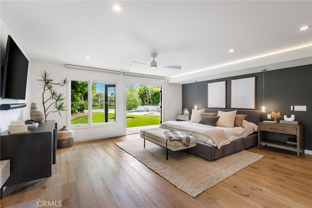 bedroom with ceiling fan and light wood-type flooring