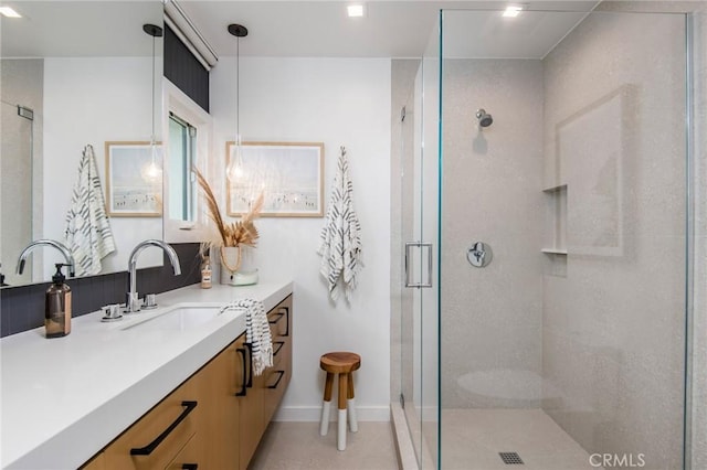 bathroom featuring walk in shower and vanity