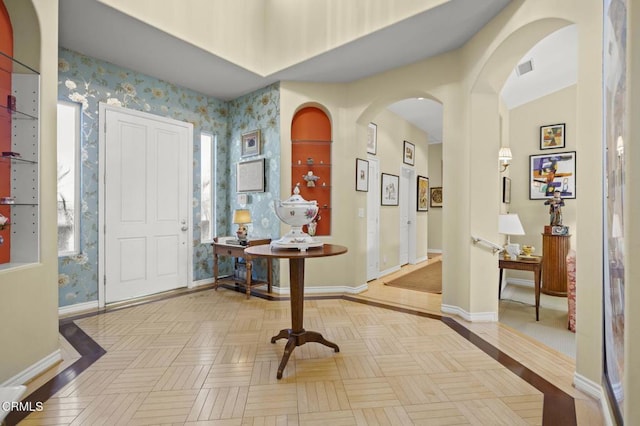 foyer entrance with light parquet flooring