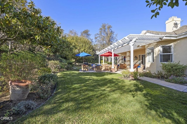 view of yard with a patio area, an outdoor hangout area, and a pergola