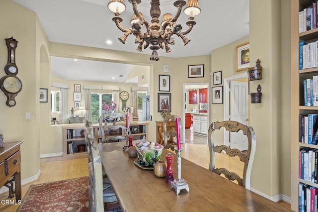 dining room featuring a chandelier and light hardwood / wood-style floors