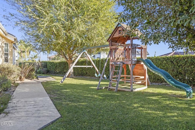 view of jungle gym featuring a lawn