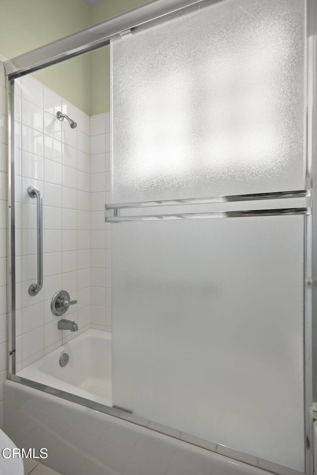 bathroom featuring enclosed tub / shower combo