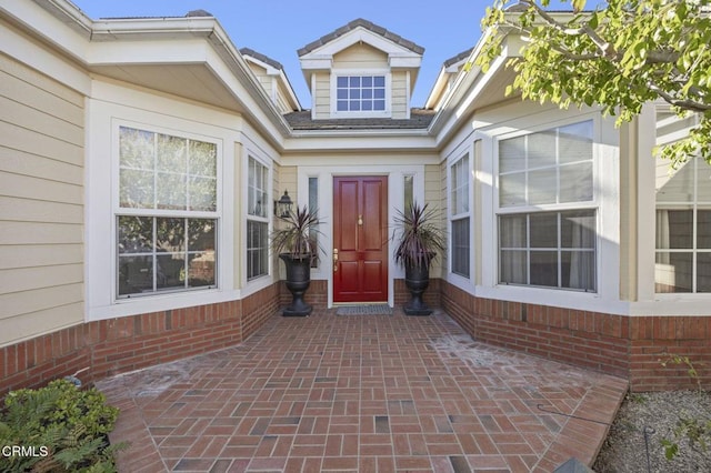 entrance to property featuring a patio area