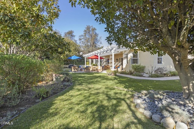 view of yard with an outdoor hangout area and a pergola