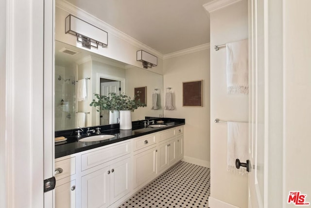 bathroom with ornamental molding, walk in shower, and vanity