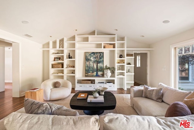 living room with hardwood / wood-style flooring and lofted ceiling