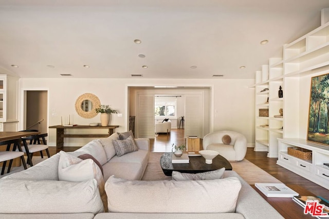 living room featuring dark hardwood / wood-style flooring