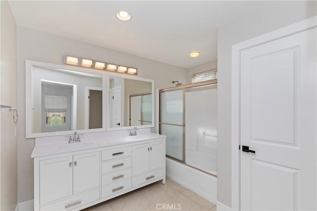 bathroom with tile patterned floors, enclosed tub / shower combo, and vanity