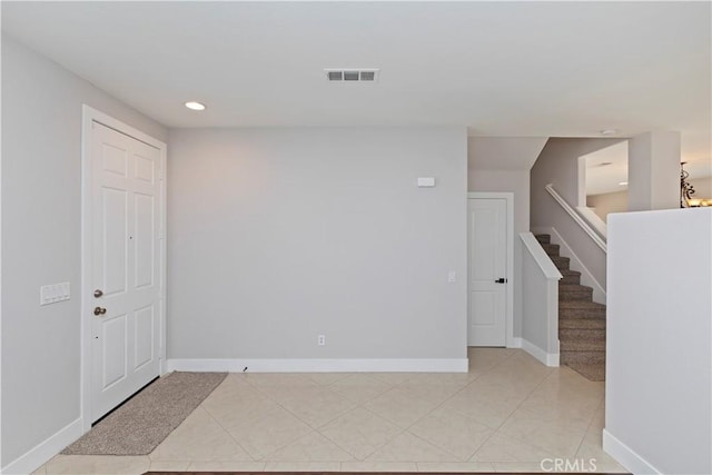 empty room with light tile patterned floors