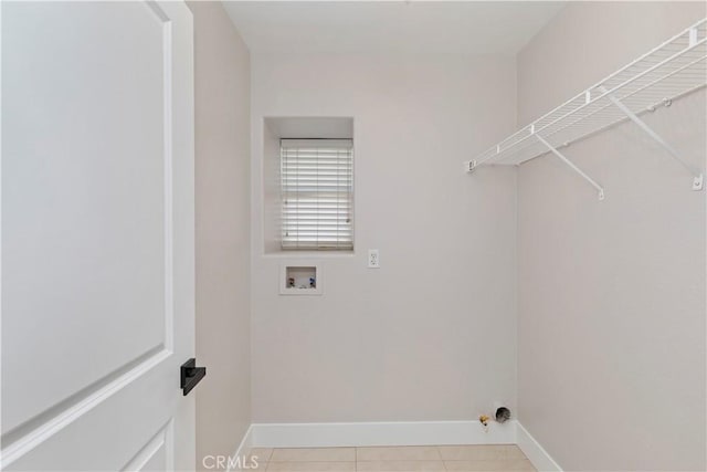 laundry area featuring light tile patterned flooring and hookup for a washing machine