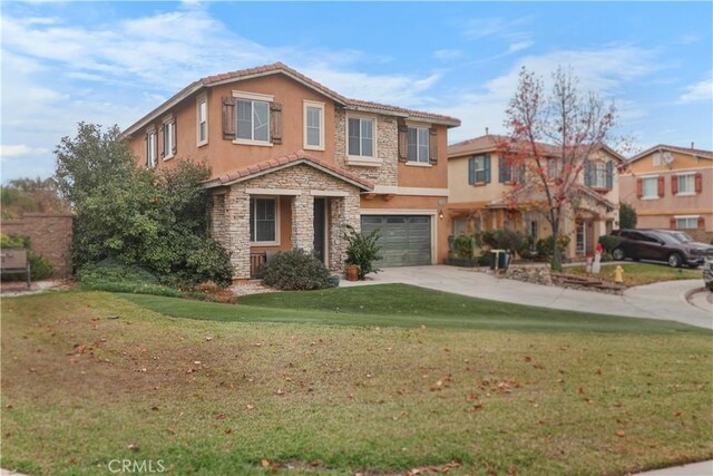 view of front of house with a front yard and a garage