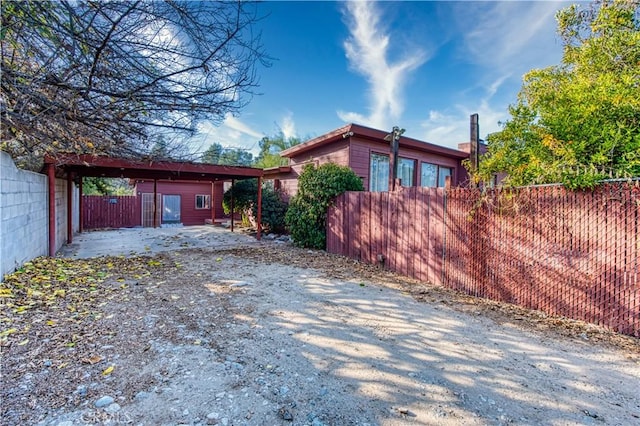 view of home's exterior with an outbuilding