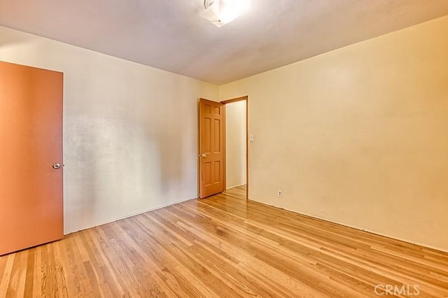 unfurnished room with light hardwood / wood-style floors