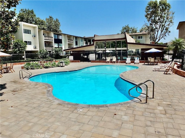 view of swimming pool featuring a patio